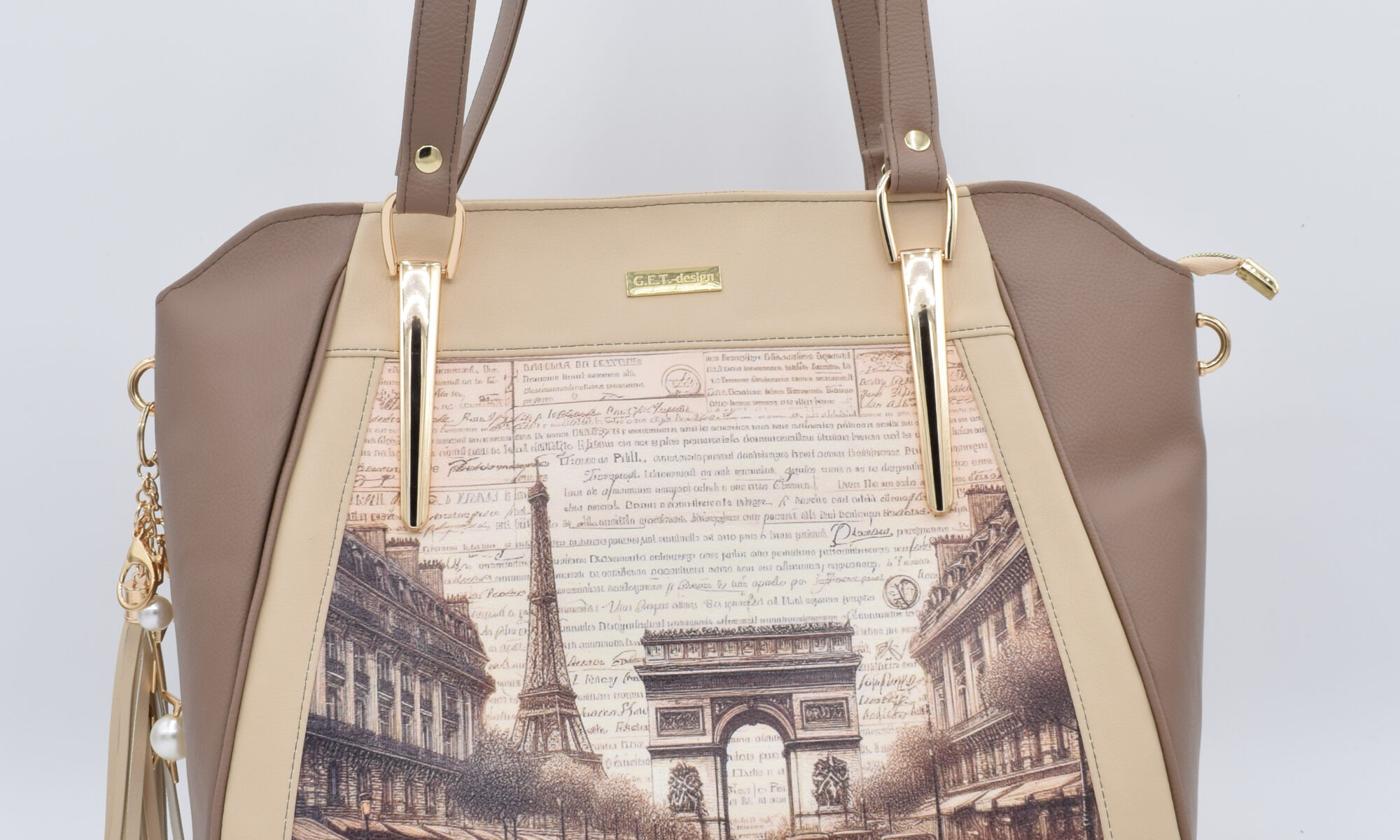 Schultertasche in beige mit Paris-Motiv